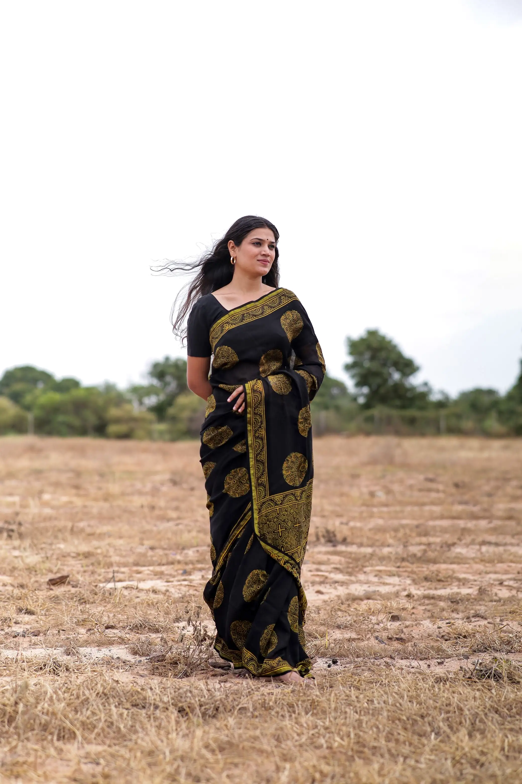 Jharokha -Black and green floral silk cotton Ajrakh handblockprinted saree